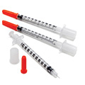 Three medical syringes.